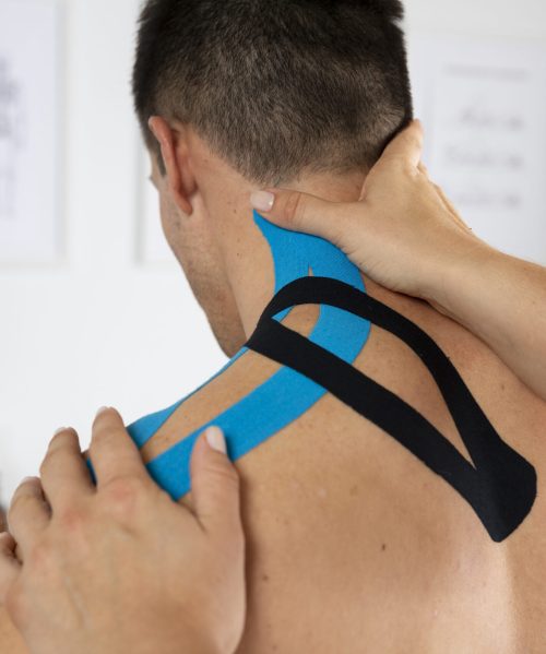 female-physiotherapist-applying-elastic-medical-bandage-male-patient