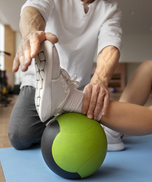 patient-doing-physical-rehabilitation-helped-by-therapists