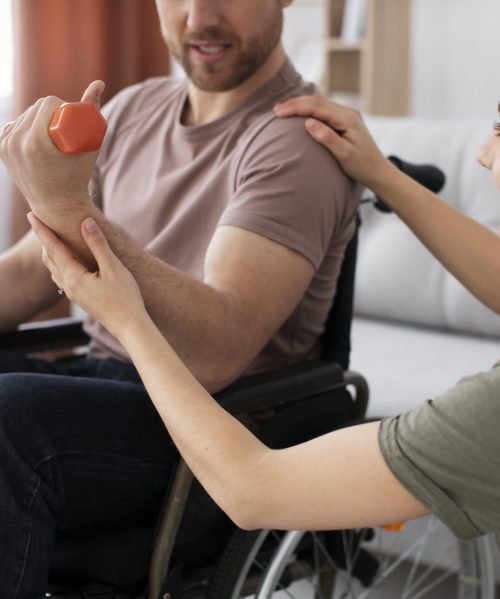 young-adult-helping-disabled-friend